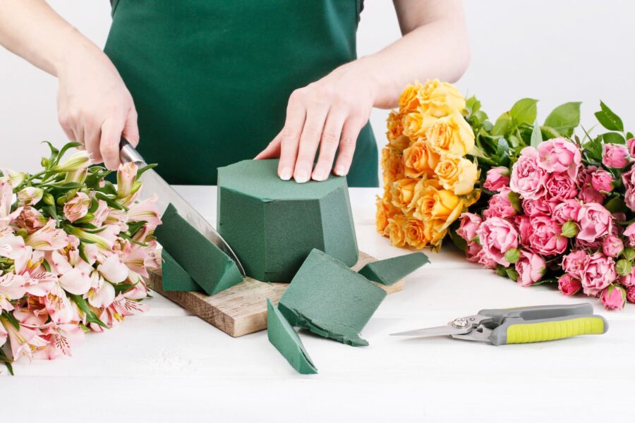 florist creating bespoke flower arrangement for local flower delivery